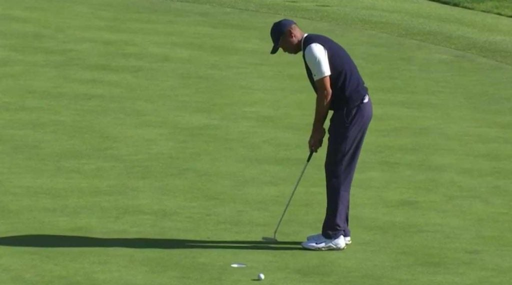 Tiger Woods misses a two-foot par putt on No. 13 on Saturday at Riviera.