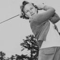 Mickey Wright swings a golf club.