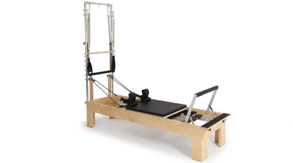 The Reformer: a torture device or surefire savior for back pain?  I was about to find out.