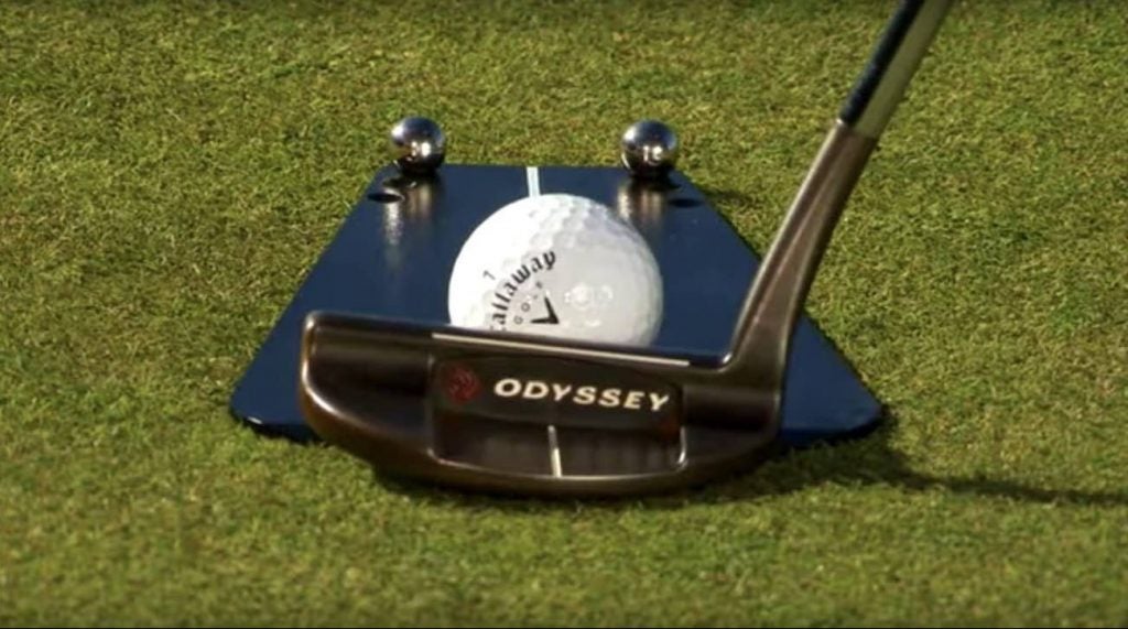 A close up of Phil Mickelson using a Pelz Putting tutor