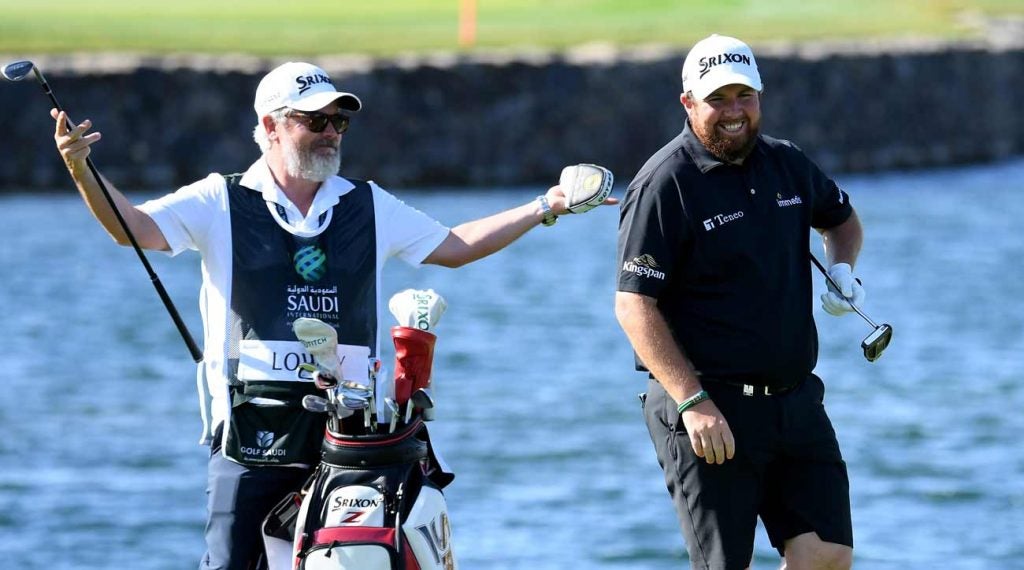 Shane Lowry shares a laugh with his caddie Bo Martin at the Saudi International.