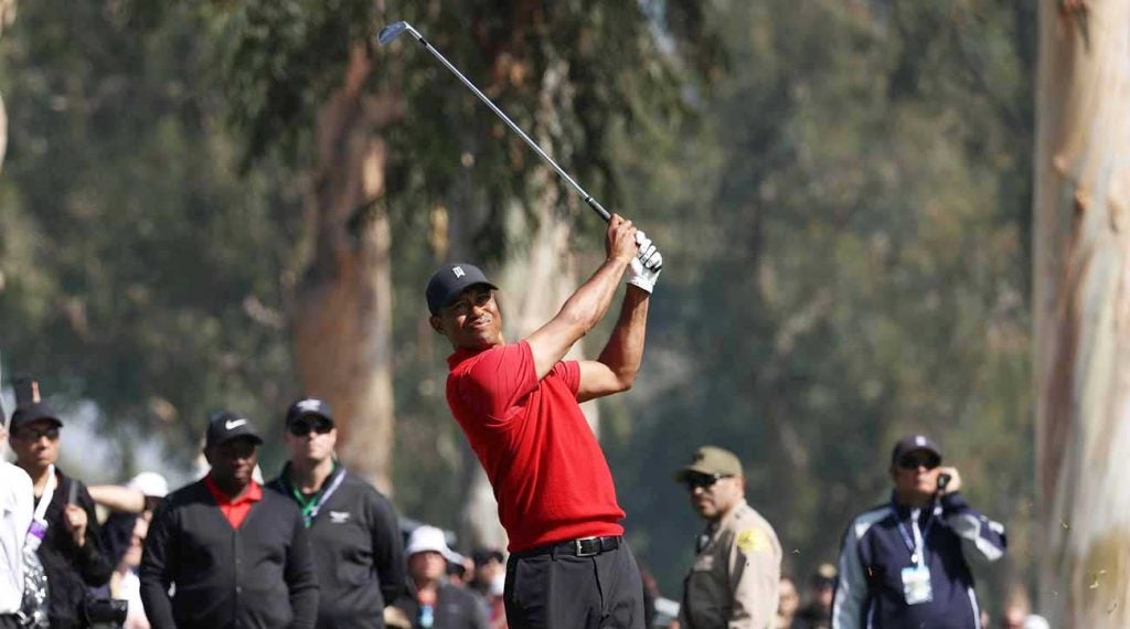 Tiger Woods hits a shot during Sunday's final round of the Genesis Invitational.