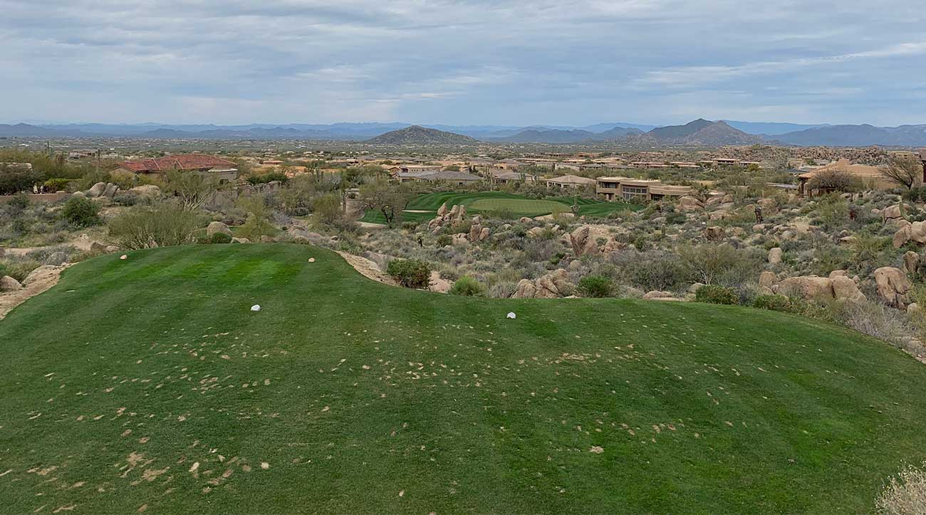 The par-3 16th at the Monument course is long, but the views from the tee box go on for miles.