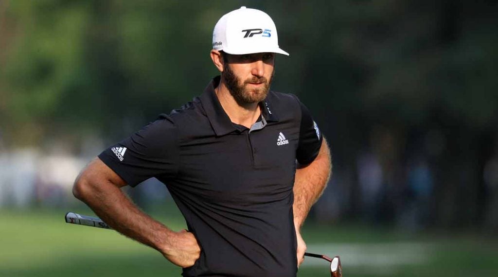 Dustin Johnson watches his playing partners putt at the WGC-Mexico Championship.