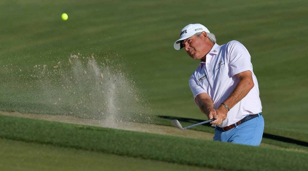 Fred couples hits a shot from the bunker at the 2020 Cologuard Classic