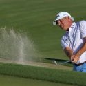 Fred couples hits a shot from the bunker at the 2020 Cologuard Classic