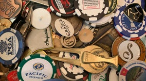A collection of golf ball markers.