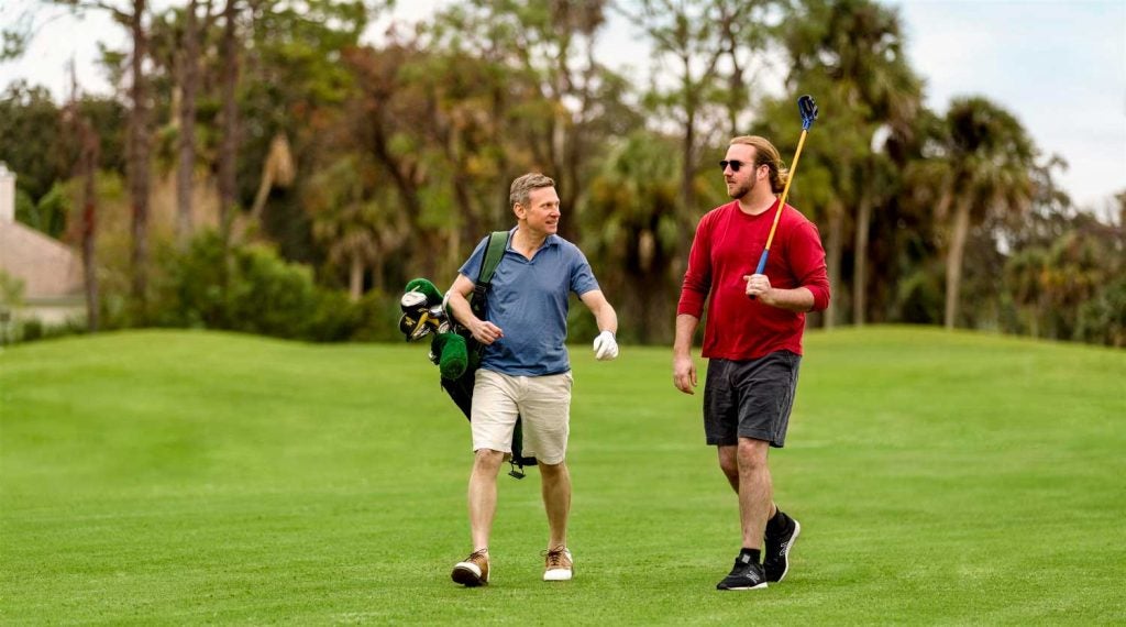 Fling golfer and regular golfer playing together
