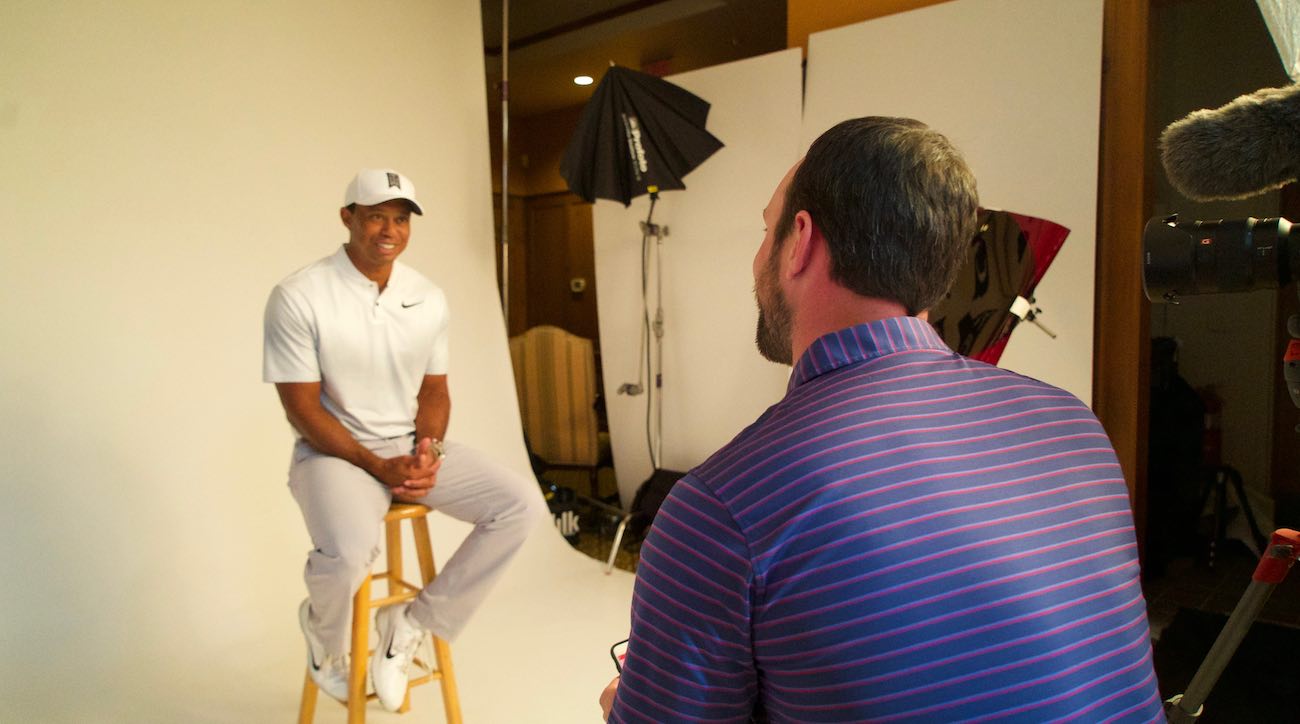 Just two guys talking equipment on stools. 