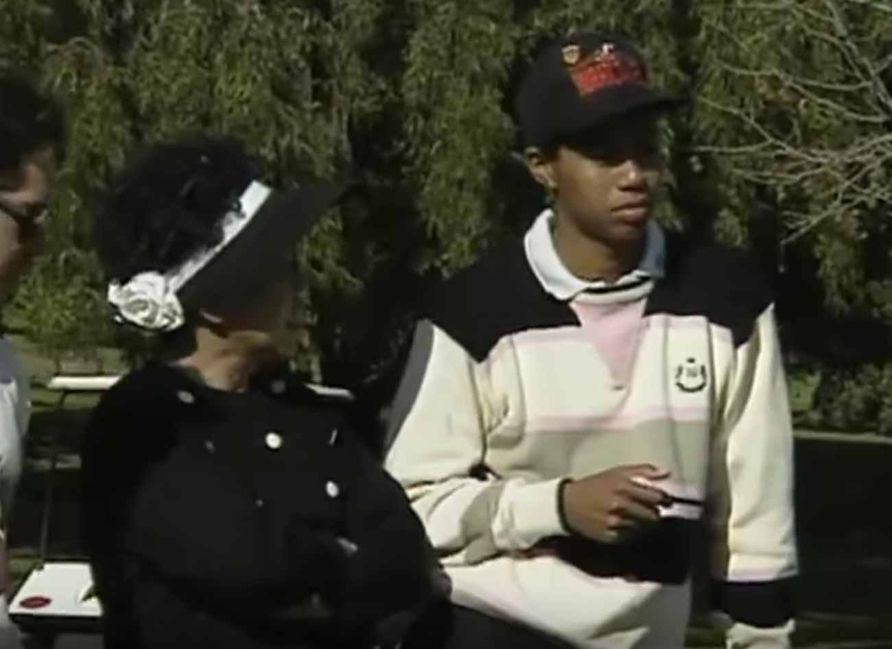 Tiger Woods (in Hurricanes hat) alongside his mother Kultida.