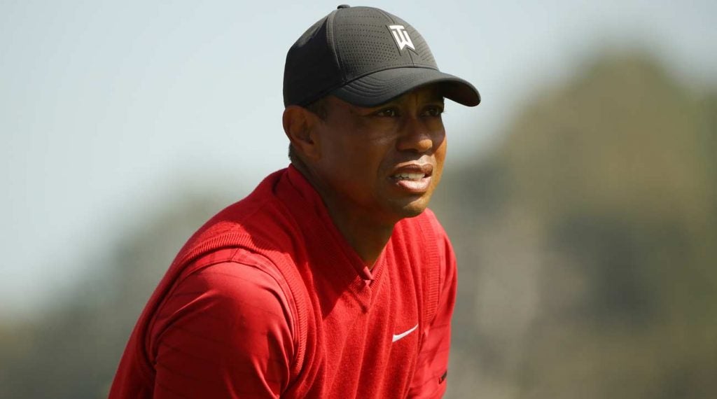 Tiger Woods watches a golf shot