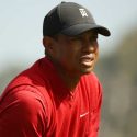 Tiger Woods watches a golf shot