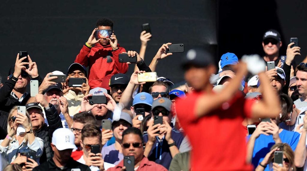 Tiger Woods fans taking photographs