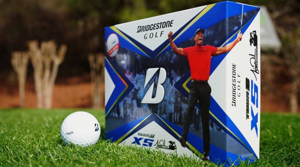 The new Bridgestone Tour B XS Tiger Woods Edition golf ball package on grass