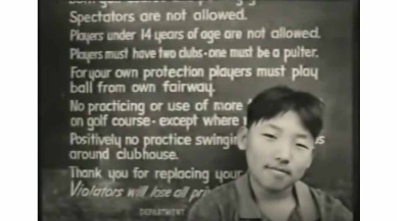 Among the ad's most powerful imagery is a kid sitting in front of golf's 