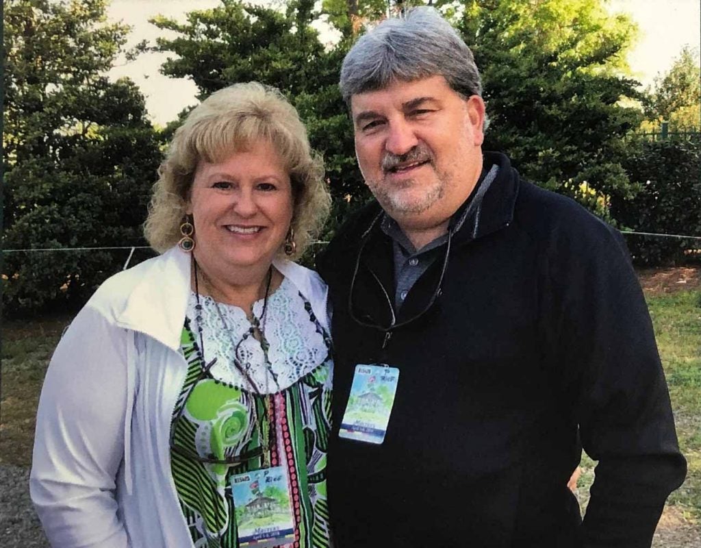 Johnny Pruitt and his wife Christine wearing their Masters badges on Friday in 2018.