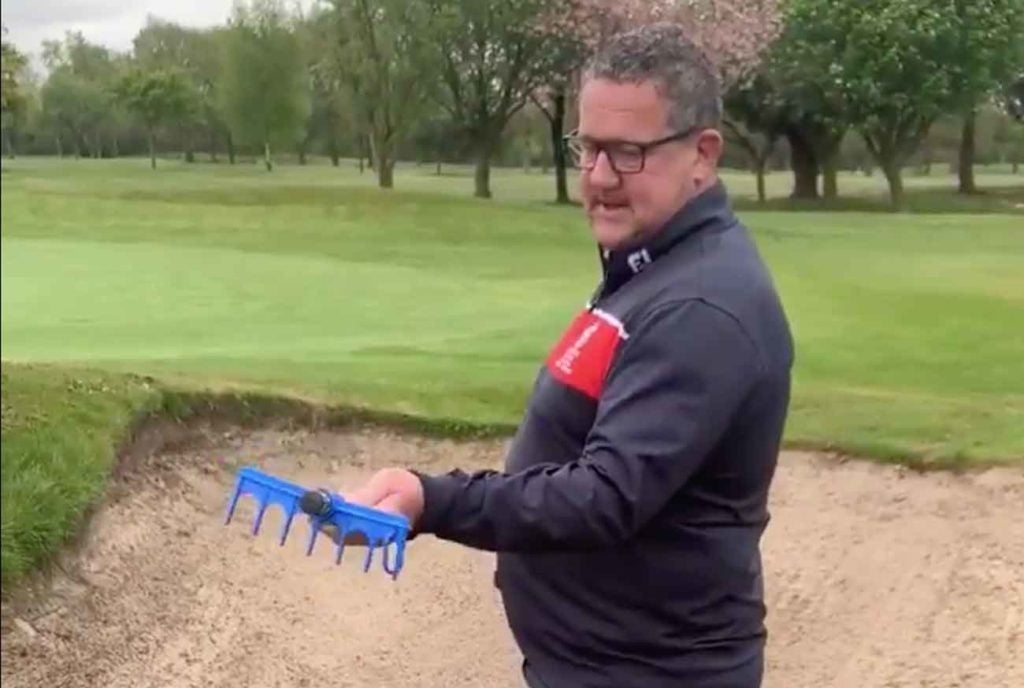 The "personal bunker rake" at the Garforth Golf Club is used by John Dexter, the club's managing secretary.