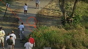 Suddenly, Tiger Woods' ball reappeared — bouncing down the cart path in the opposite direction!