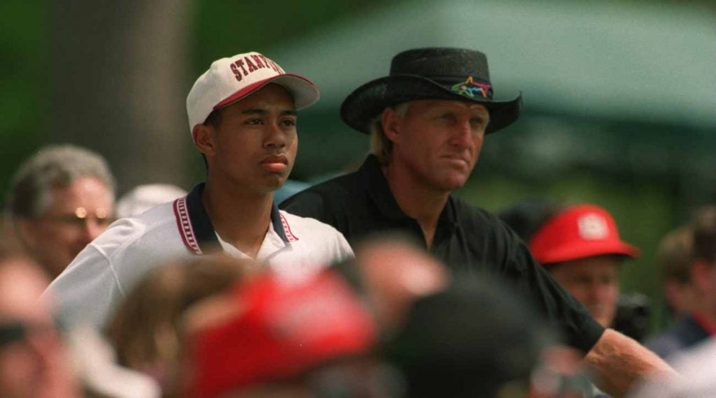 Tiger Woods and Greg Norman during a practice round at the 1995 Masters.