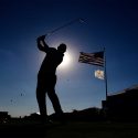 Golfer tee shot american flag