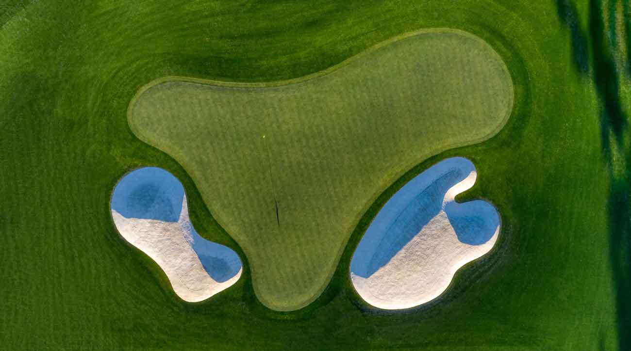 Not a footstep in the sand on the par-5 second. Tiger Woods has put few in them — in 22 Masters tournaments, he is 29-under here. 