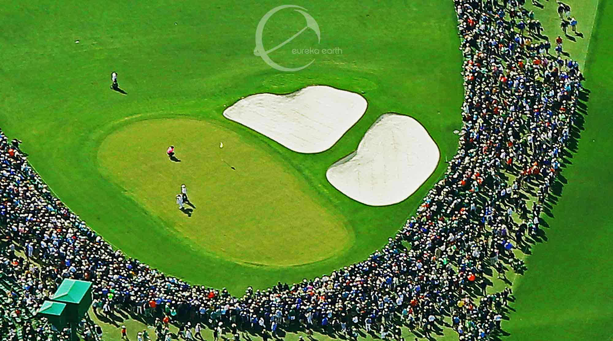 Patrick Reed, in pink shirt, on the 9th green in the fourth round of the 2018 Masters.