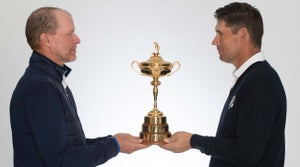 Steve Stricker and Padraig Harrington hold the Ryder Cup.