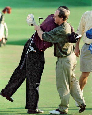 Tiger Woods hugs Bob May
