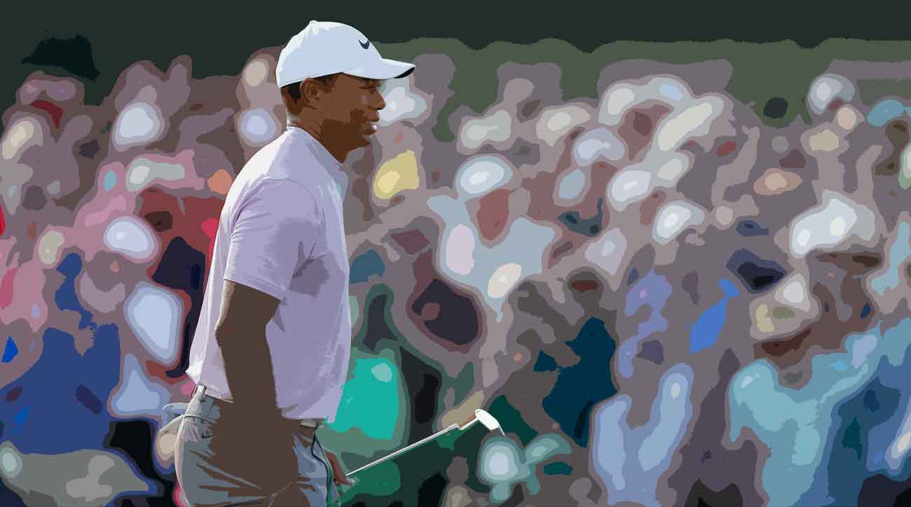 Tiger Woods fired a 69 to grab a share of the third-round lead.