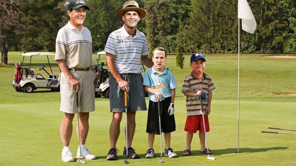 Tom Brady, Phil Mickelson, Peyton Manning, Tiger Woods on a golf course