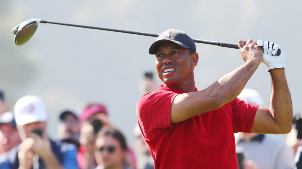 Tiger Woods tees off during an event earlier this year.