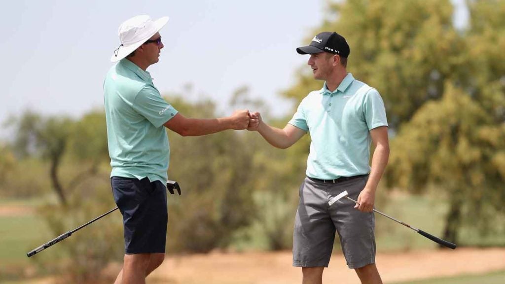 Joel Dahmen, left, and Zach Smith fist-bump after Smith's victory at the Scottsdale Open.