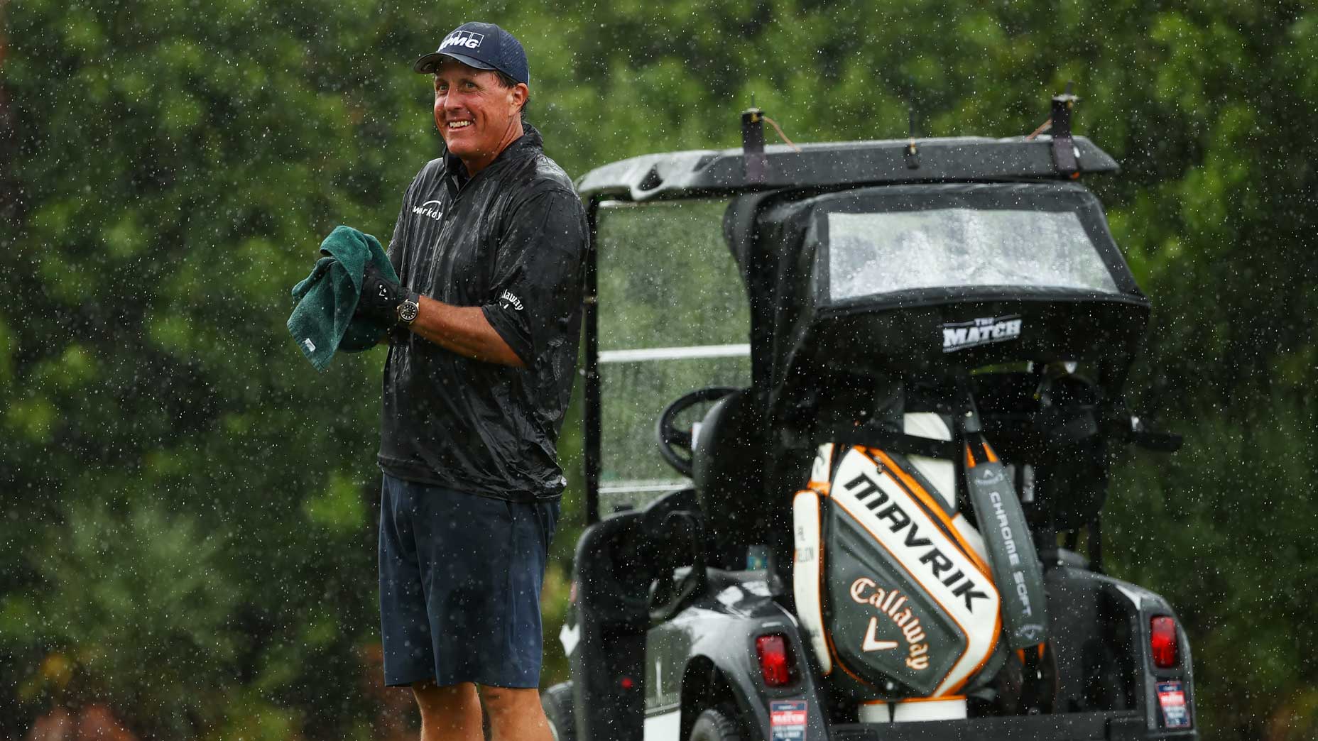 Phil Mickelson wipes his hands at Medalist Golf Club.