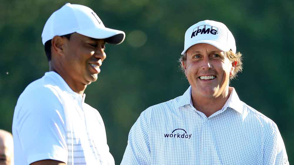 Tiger Woods and Phil Mickelson each donated items to the All In Challenge fundraiser.