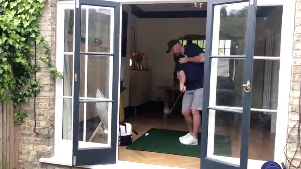 Thomas Bjorn's chip shot goes a little right during an instructional video.