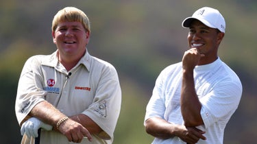 John Daly and Tiger Woods share a laugh in 2005.
