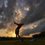 college golfer on range