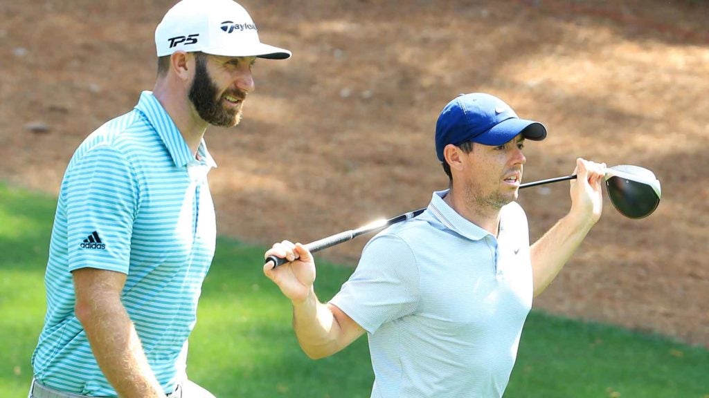 Pro golfers Dustin Johnson and Rory McIlroy