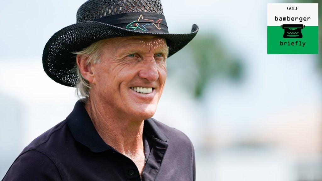 Golfer Greg Norman smiles on golf course