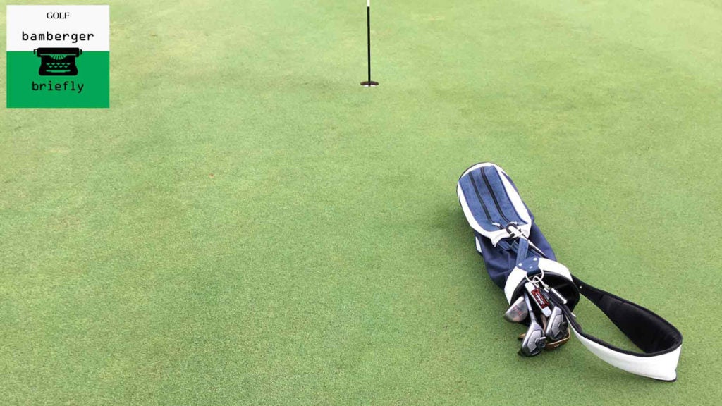 Golf bag lies on Medalist golf green