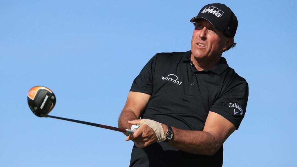 Phil Mickelson watches golf drive
