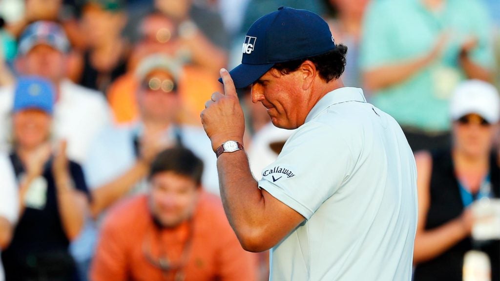 Phil Mickelson tips his cap at the Masters.