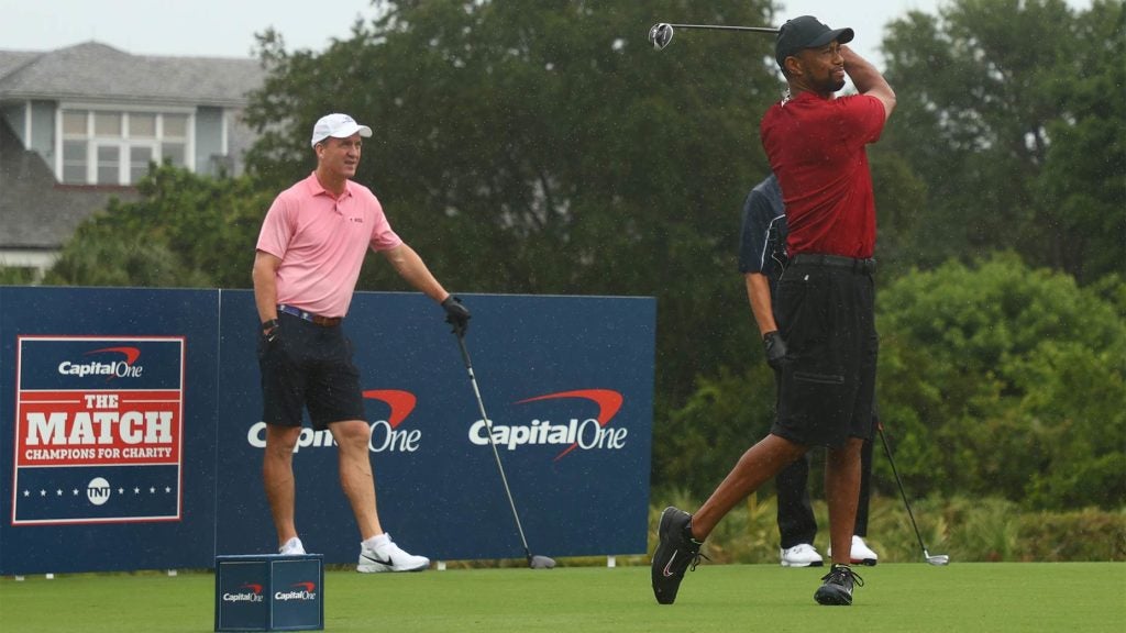 Tiger Woods tees off on the first hole on Sunday.