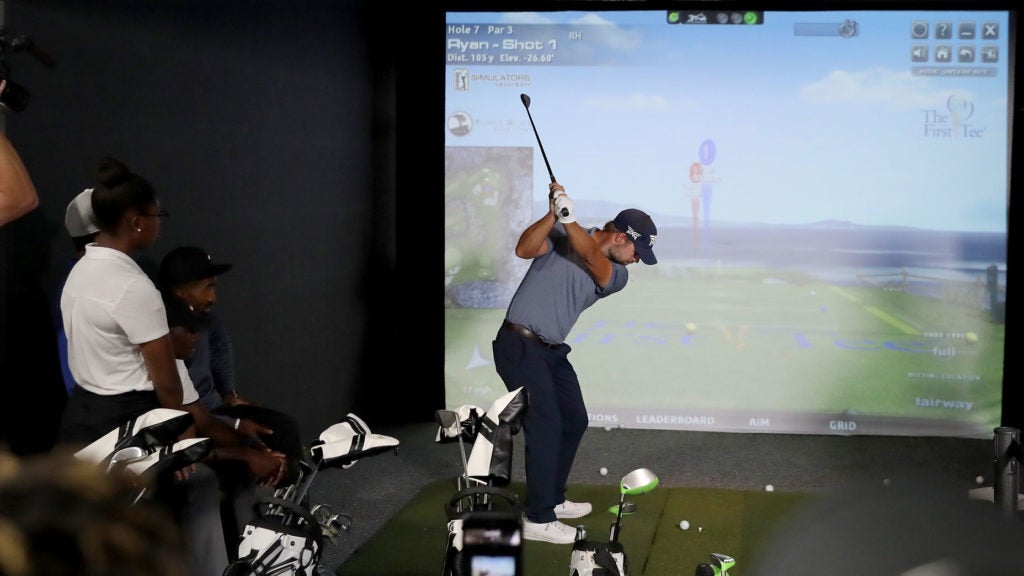 golfer hits on a simulator
