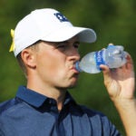 Pro golfer Jordan Spieth drinks water