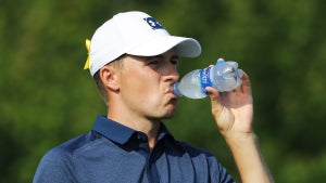 Pro golfer Jordan Spieth drinks water