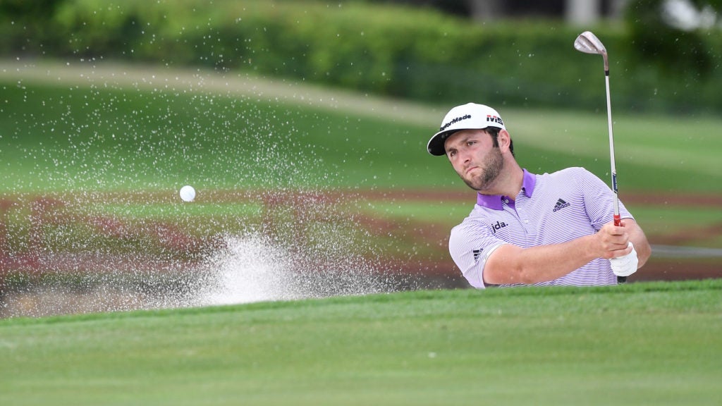 Jon Rahm hits out of the sand during last year's Charles Schwab Challenge.