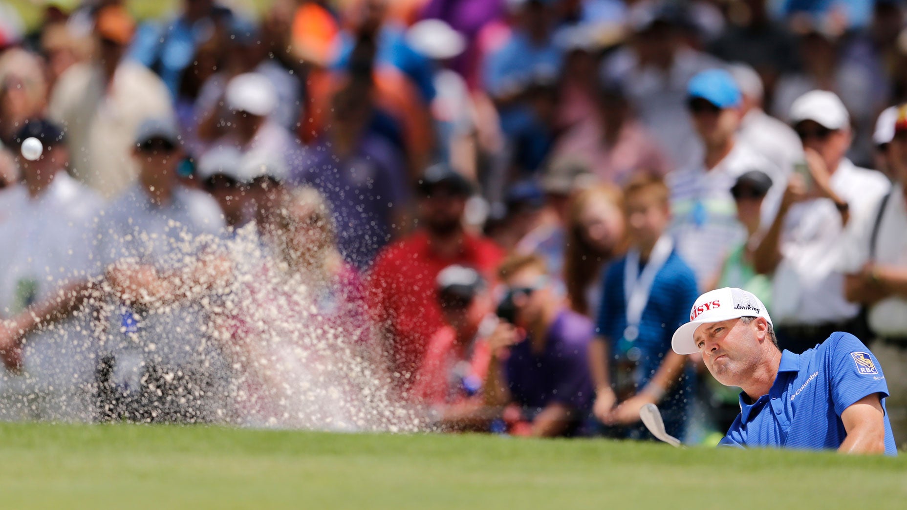 Ryan Palmer hits out of the sand during last's Kat Charles Schwab Challenge.