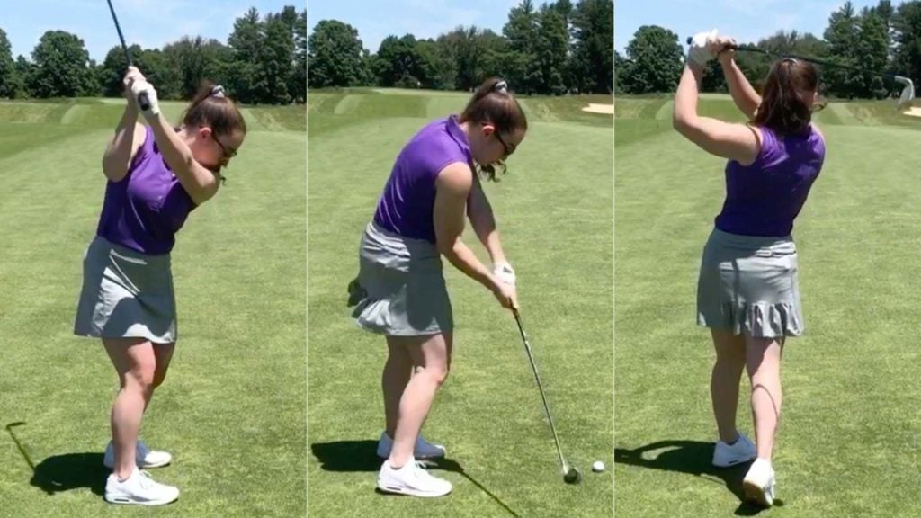 A woman makes a golf swing.