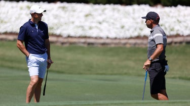 Rory McIlroy and Sergio Garcia converse from a safe distance at the Charles Schwab Challenge.